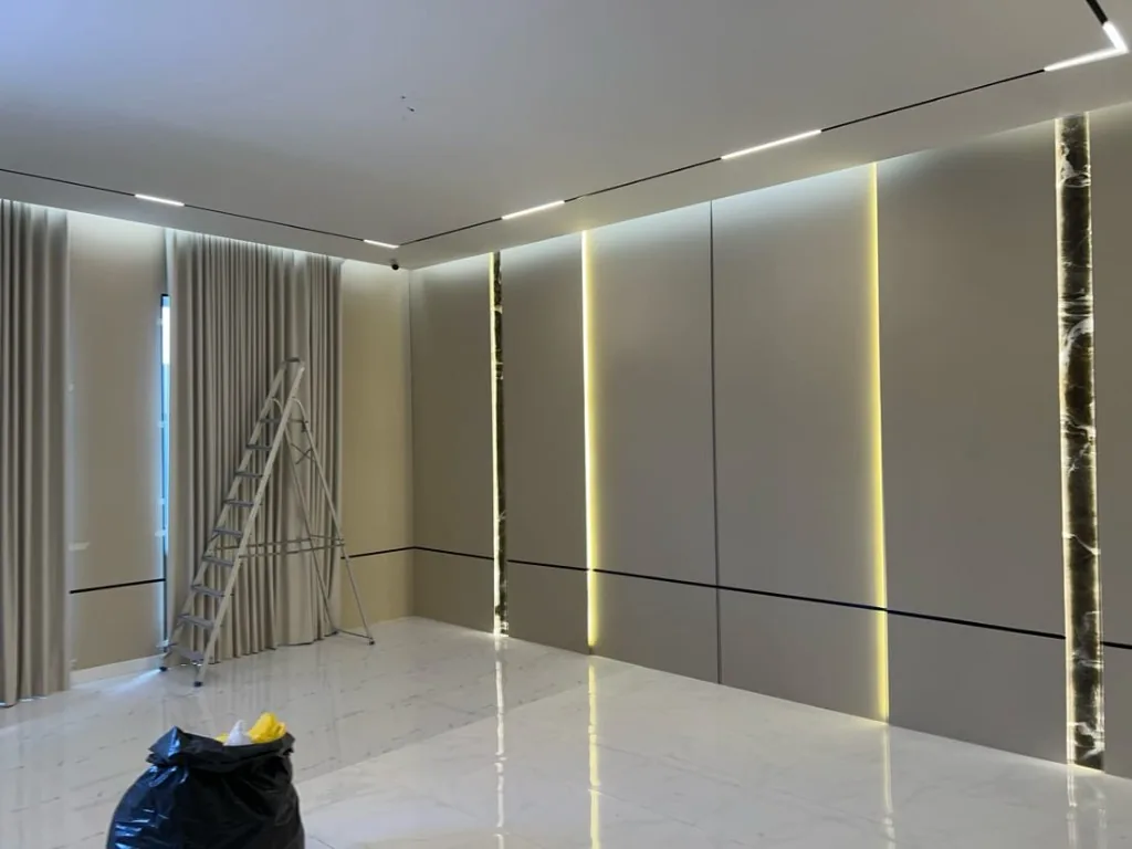 Villa interior with lit feature wall panelling — Renovation 786 Dubai